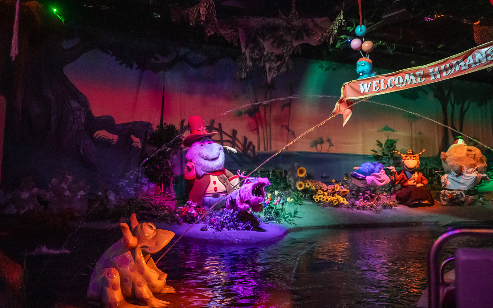 Characters in a whimsical scene at Monster Mansion, Six Flags Over Georgia.