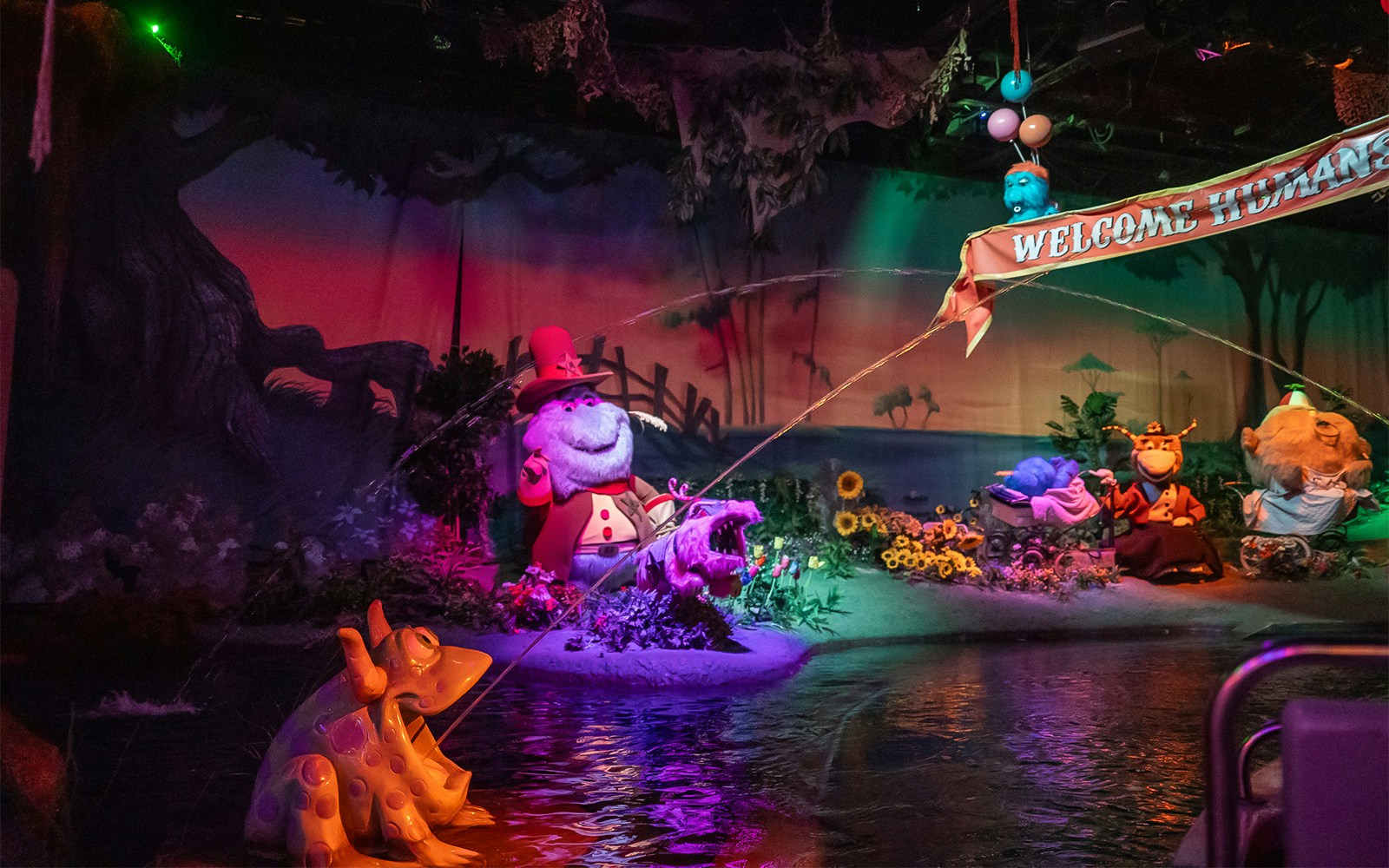 Characters in a whimsical scene at Monster Mansion, Six Flags Over Georgia.