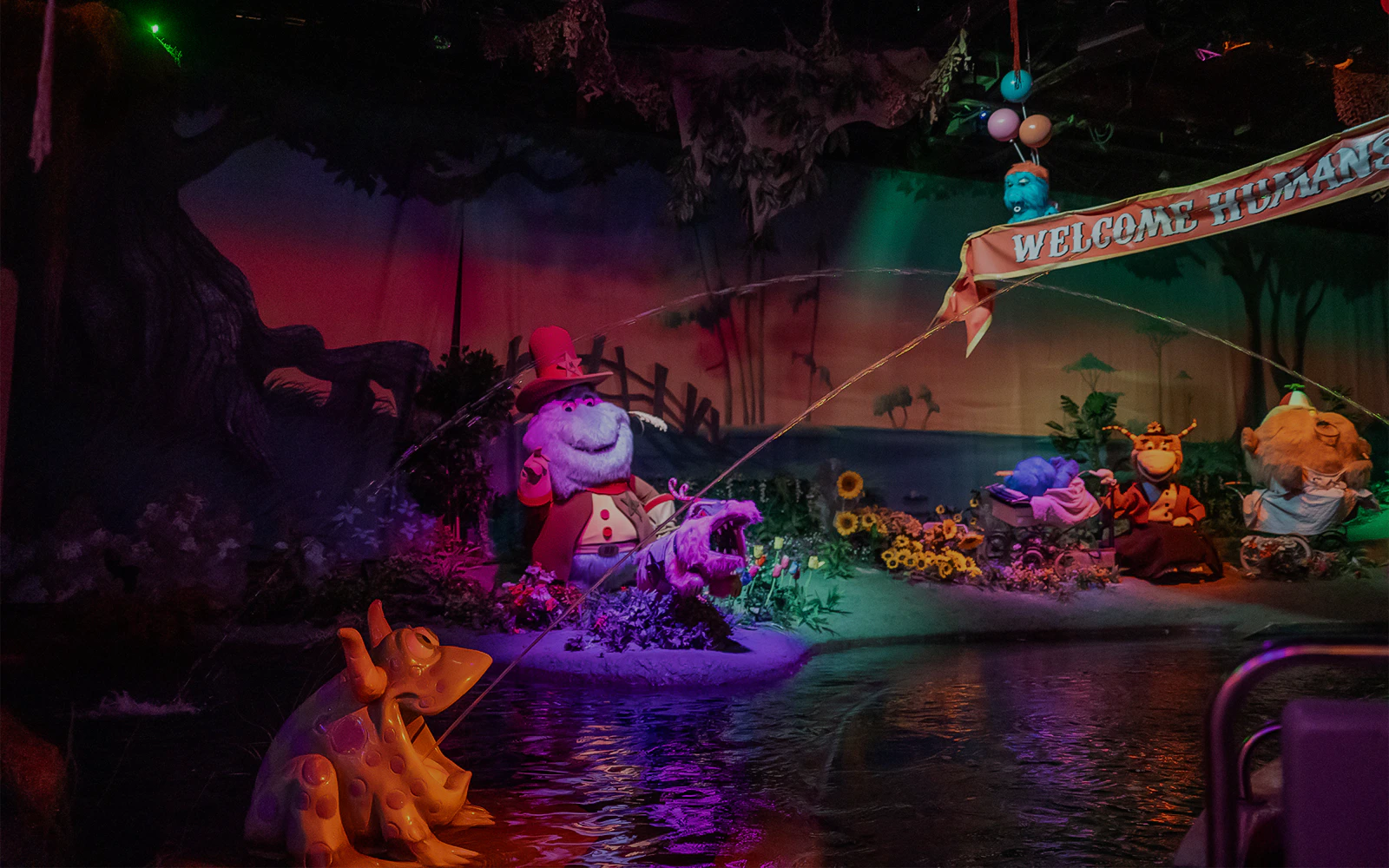 Characters in a whimsical scene at Monster Mansion, Six Flags Over Georgia.