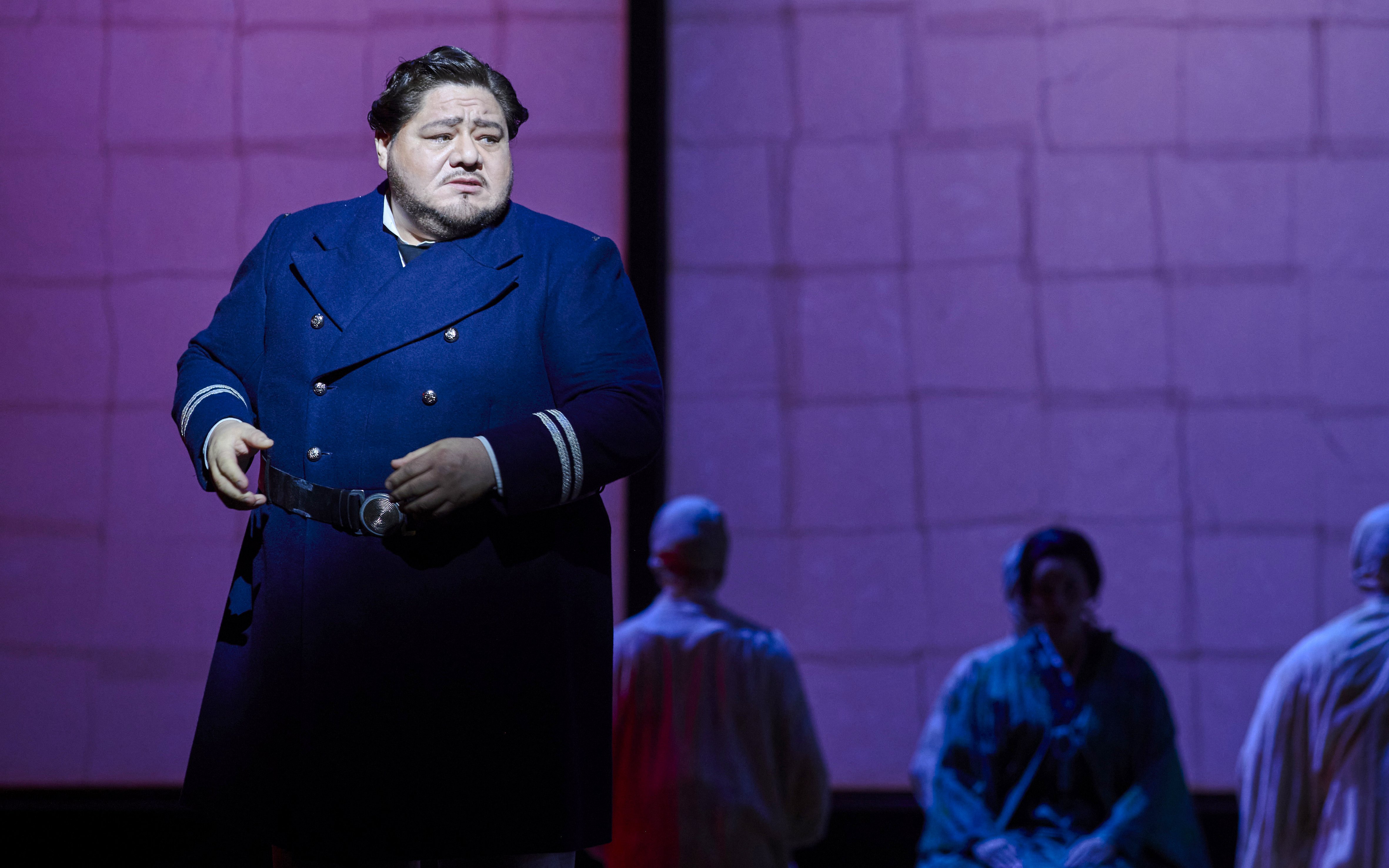 Stage performance of Madama Butterfly in Sydney with a performer in a navy coat.