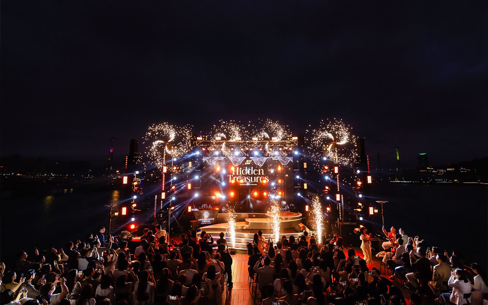 Night show with fireworks on Ambassador cruise stage, "Hidden Treasures" performance.