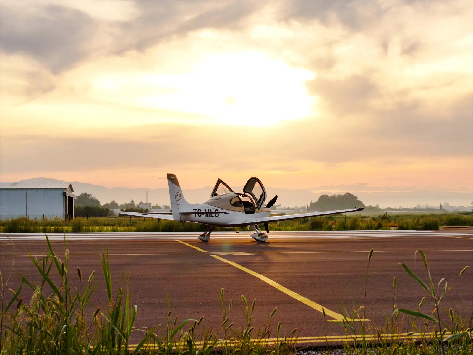 Cirrus plane on runway at sunrise, Kadriye, Antalya.