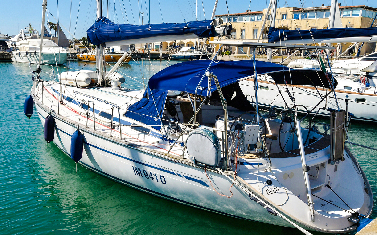 Sailboat docked in La Maddalena Archipelago marina.