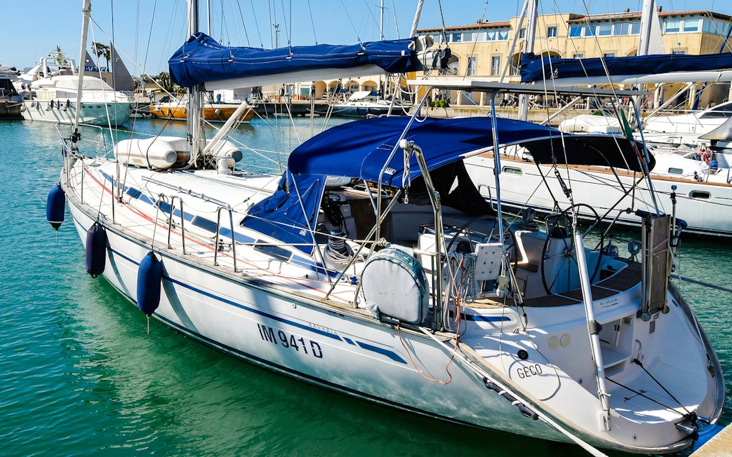 Sailboat docked in La Maddalena Archipelago marina.