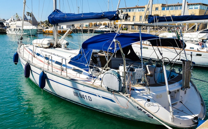 Sailboat docked in La Maddalena Archipelago marina.