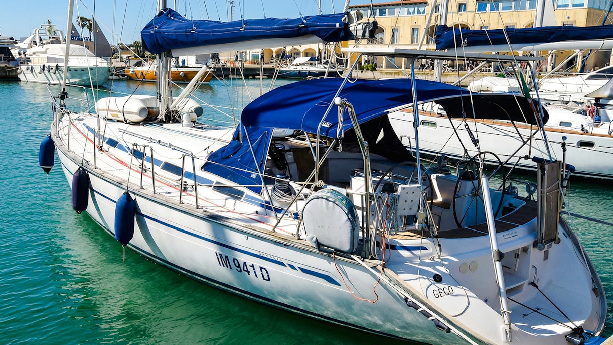 Sailboat docked in La Maddalena Archipelago marina.
