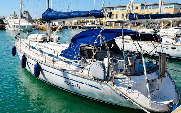 Sailboat docked in La Maddalena Archipelago marina.