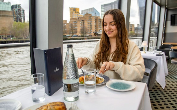 Lunch on Thames River Cruise with city view in background.