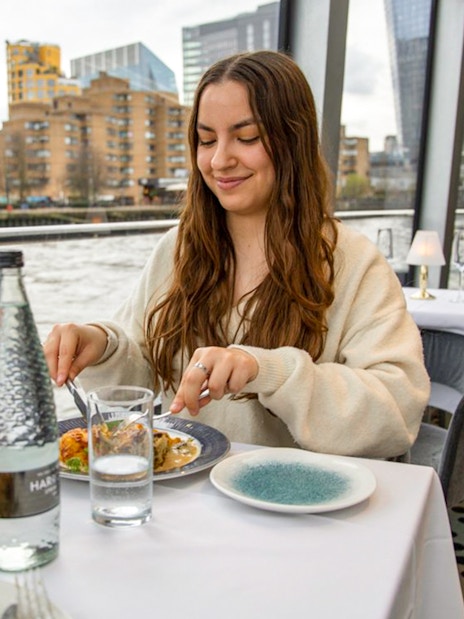 Lunch on Thames River Cruise with city view in background.