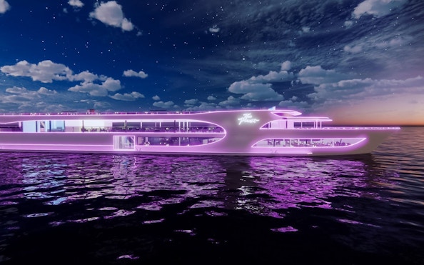 Dinner cruise ship with neon lights sailing at sunset from Asiatique Pier.