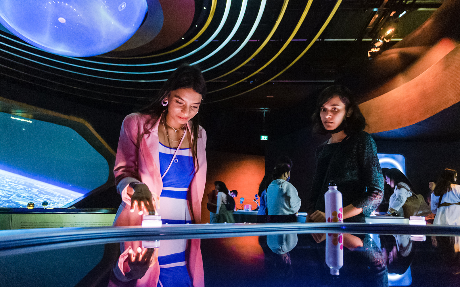 Visitors engaging with interactive exhibits at The OSS Hope, Museum of the Future, Dubai.