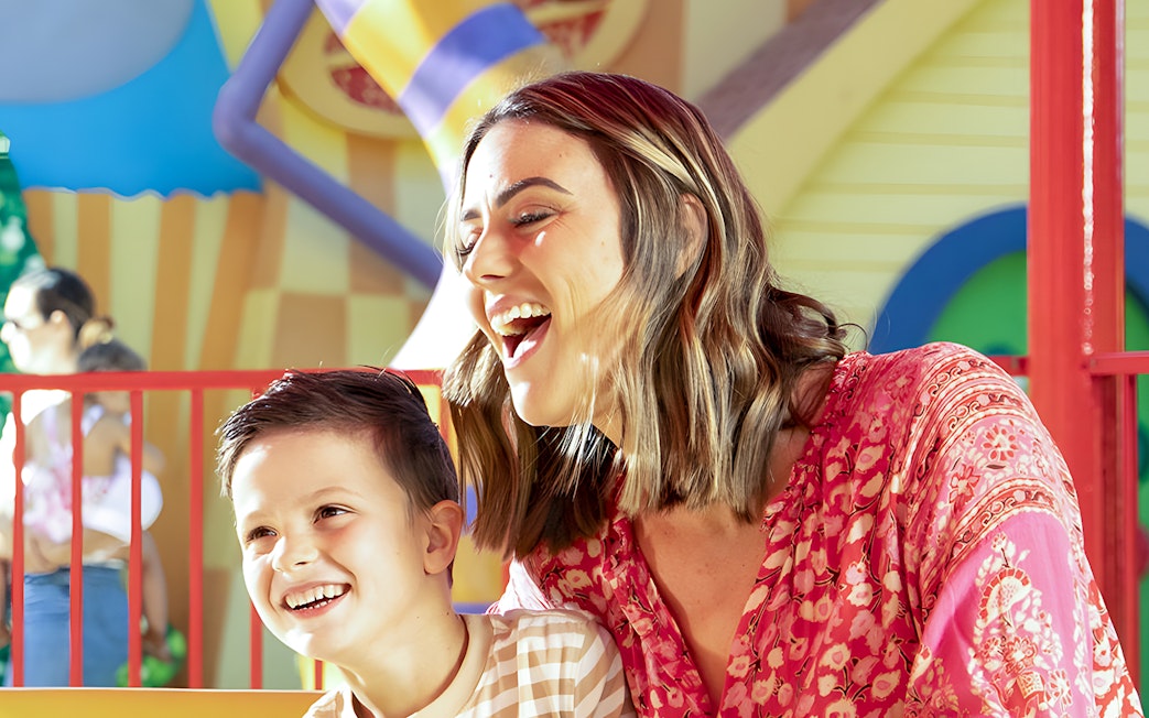 Family enjoying a ride at Dreamworld theme park.