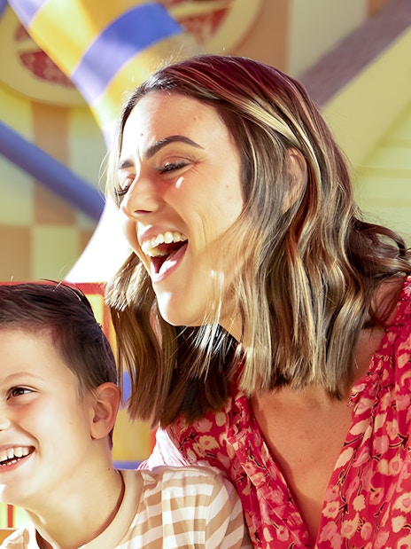 Family enjoying a ride at Dreamworld theme park.