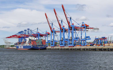 Container ship at Hamburg port near Elbphilharmonie during guided tour.