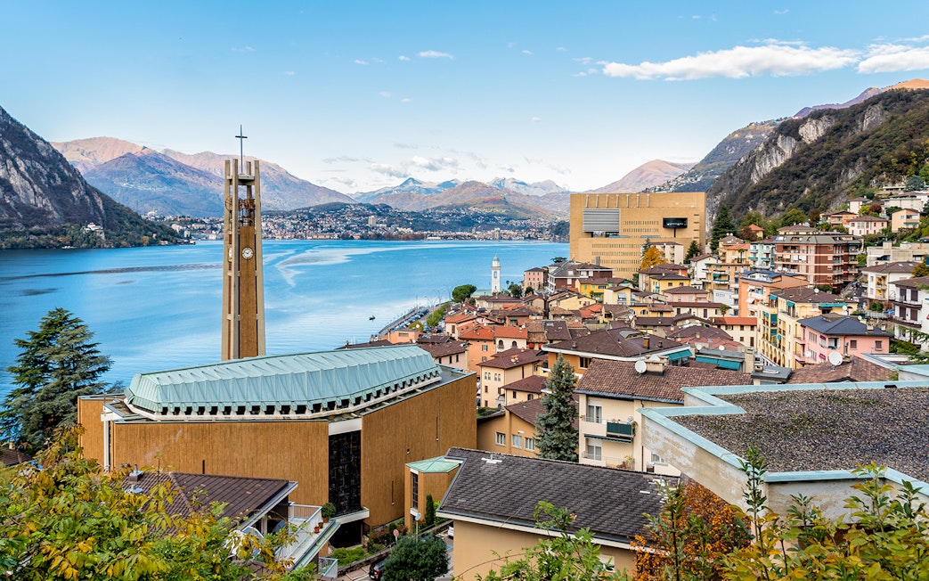 Lugano cityscape with casino and Lake Como in the background.