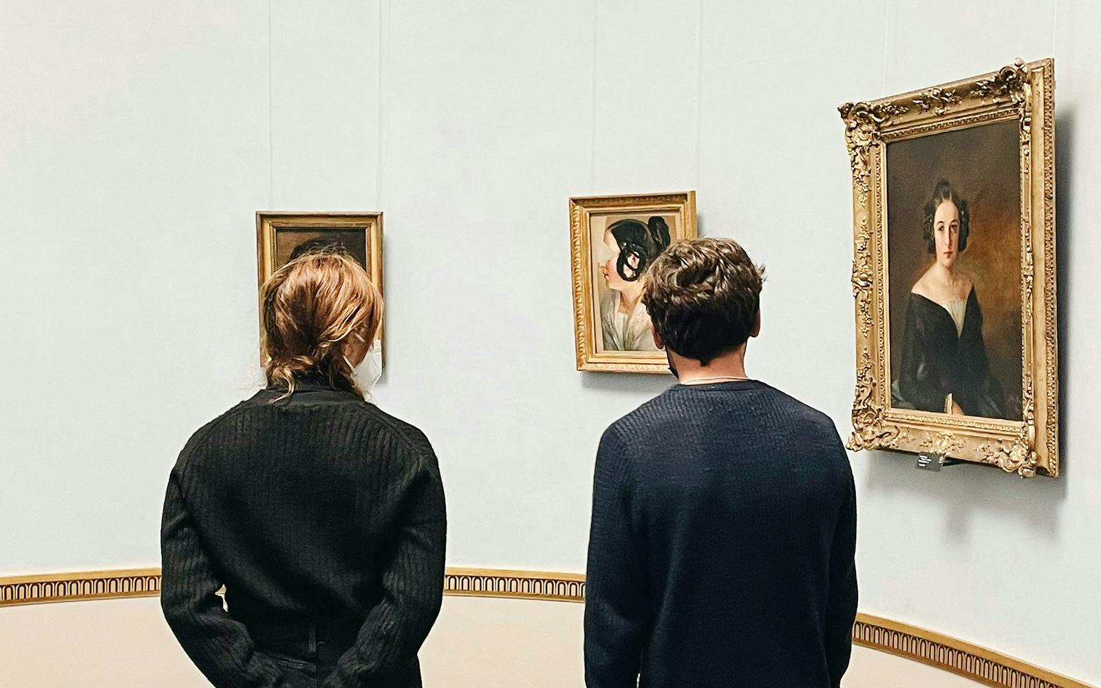 Visitors viewing paintings at Alte Nationalgalerie, Berlin.