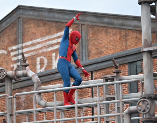 Spider-Man balancing on pipes at W.E.B. Adventure, Disneyland.