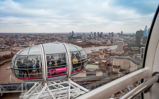 London Eye capsule overlooking Thames River and cityscape, part of combo tour with river cruise.