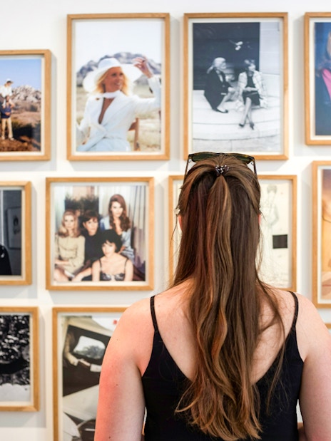 Visitor viewing fashion photography at Yves Saint Laurent Marrakesh Museum.