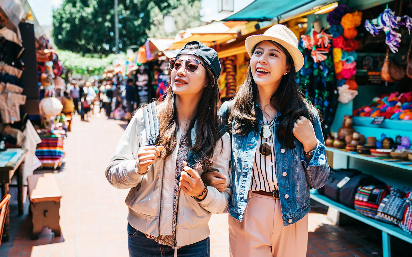 Tourists exploring vibrant local market in Mexico City.