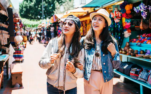 Tourists exploring vibrant local market in Mexico City.
