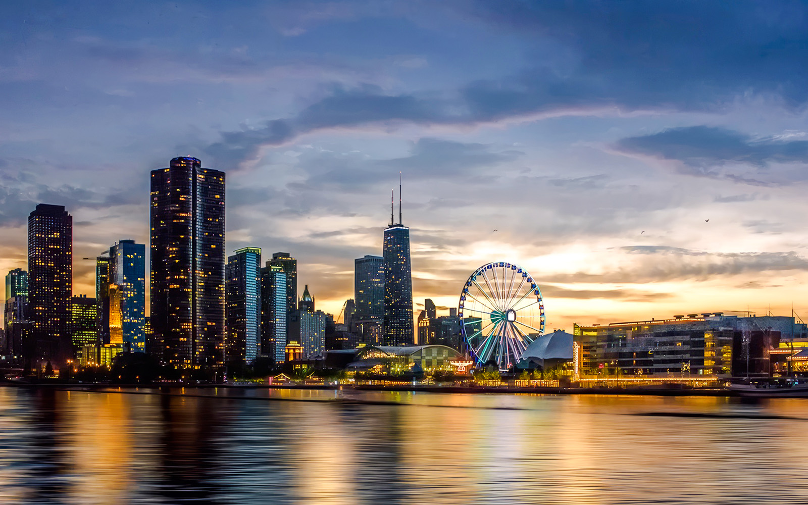 Chicago skyline at sunset with Ferris wheel on a cruise.