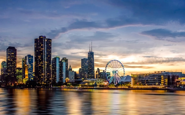 Chicago skyline at sunset with Ferris wheel on a cruise.