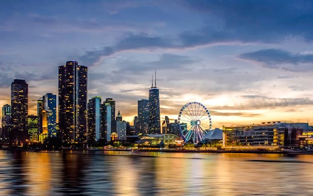 Chicago skyline at sunset with Ferris wheel on a cruise.