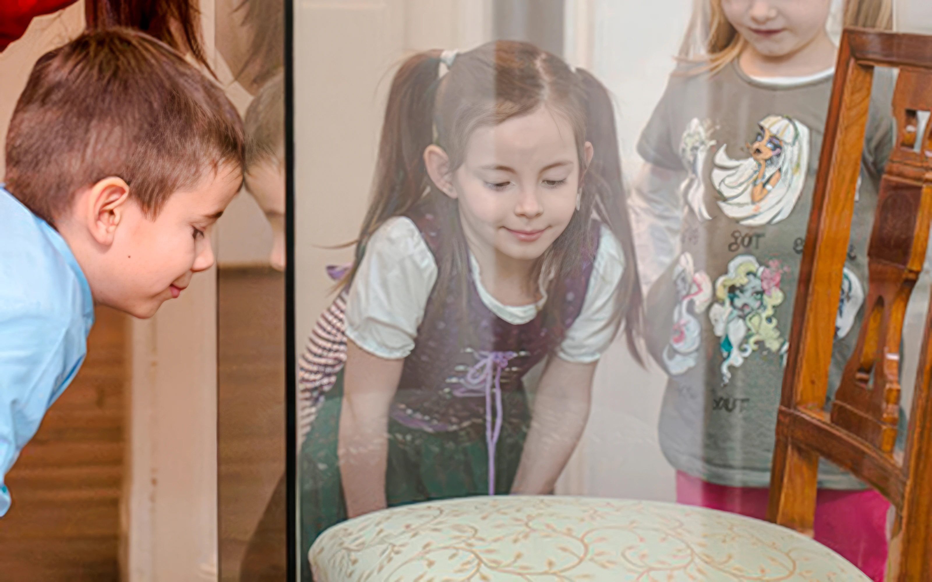 Children observing period furnishings at Mozarthaus Vienna.