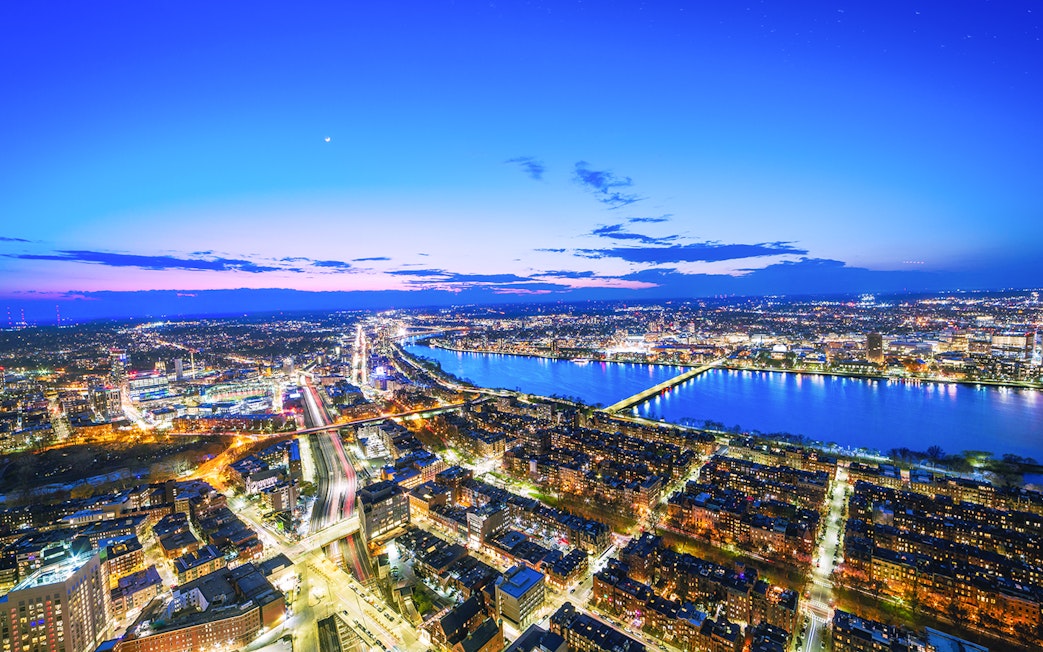 Night view of Boston skyline and Charles River from Prudential Tower.