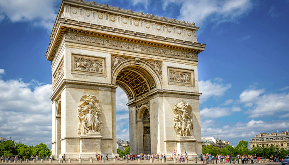 Arc De Triomphe with sculptures and tourists in Paris, France.