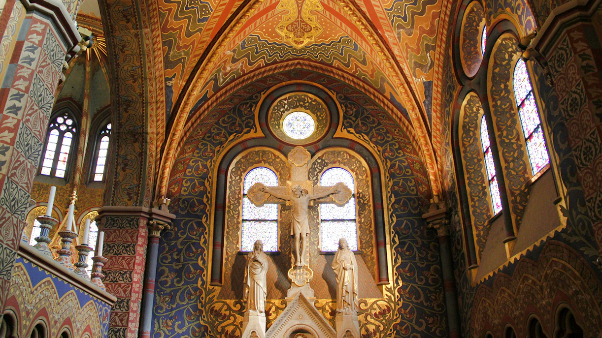 Chapel interior of Matthias Church with ornate stained glass and religious statues, Budapest, Hungary.