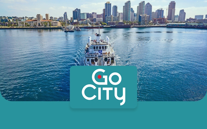 San Diego skyline with a tour boat on the bay, promoting Go San Diego Card.