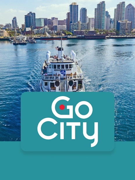 San Diego skyline with a tour boat on the bay, promoting Go San Diego Card.