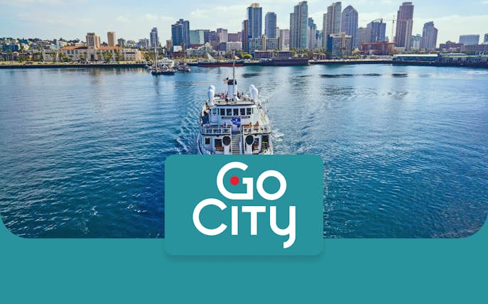 San Diego skyline with a tour boat on the bay, promoting Go San Diego Card.