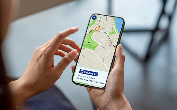 Bus tracking app on phone showing Waiheke Island hop on hop off tour bus route.