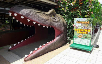 Dinosaur mouth entrance at Okashigoten Nago Dino Park, Yanbaru Subtropical Forest.