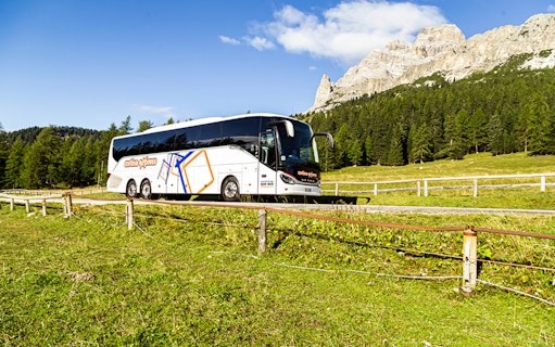 Venice airport transfer bus driving through scenic countryside.