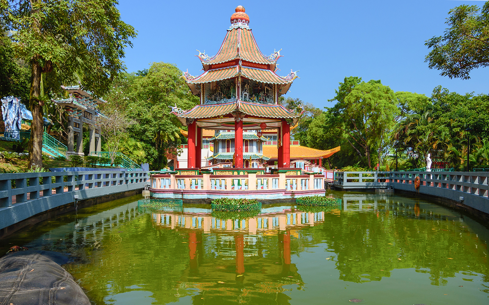 Haw Par Villa entrance with colorful statues and intricate Chinese architecture in Singapore.