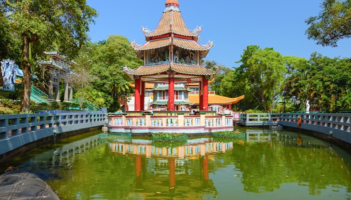 Haw Par Villa entrance with colorful statues and intricate Chinese architecture in Singapore.