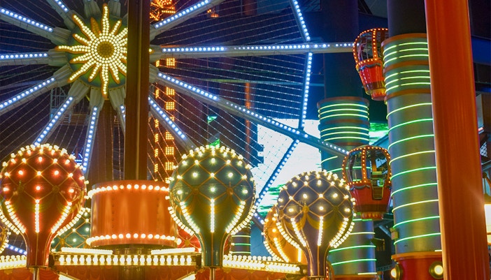 Ferris wheel and colorful lights at Skytropolis, Genting Highlands.
