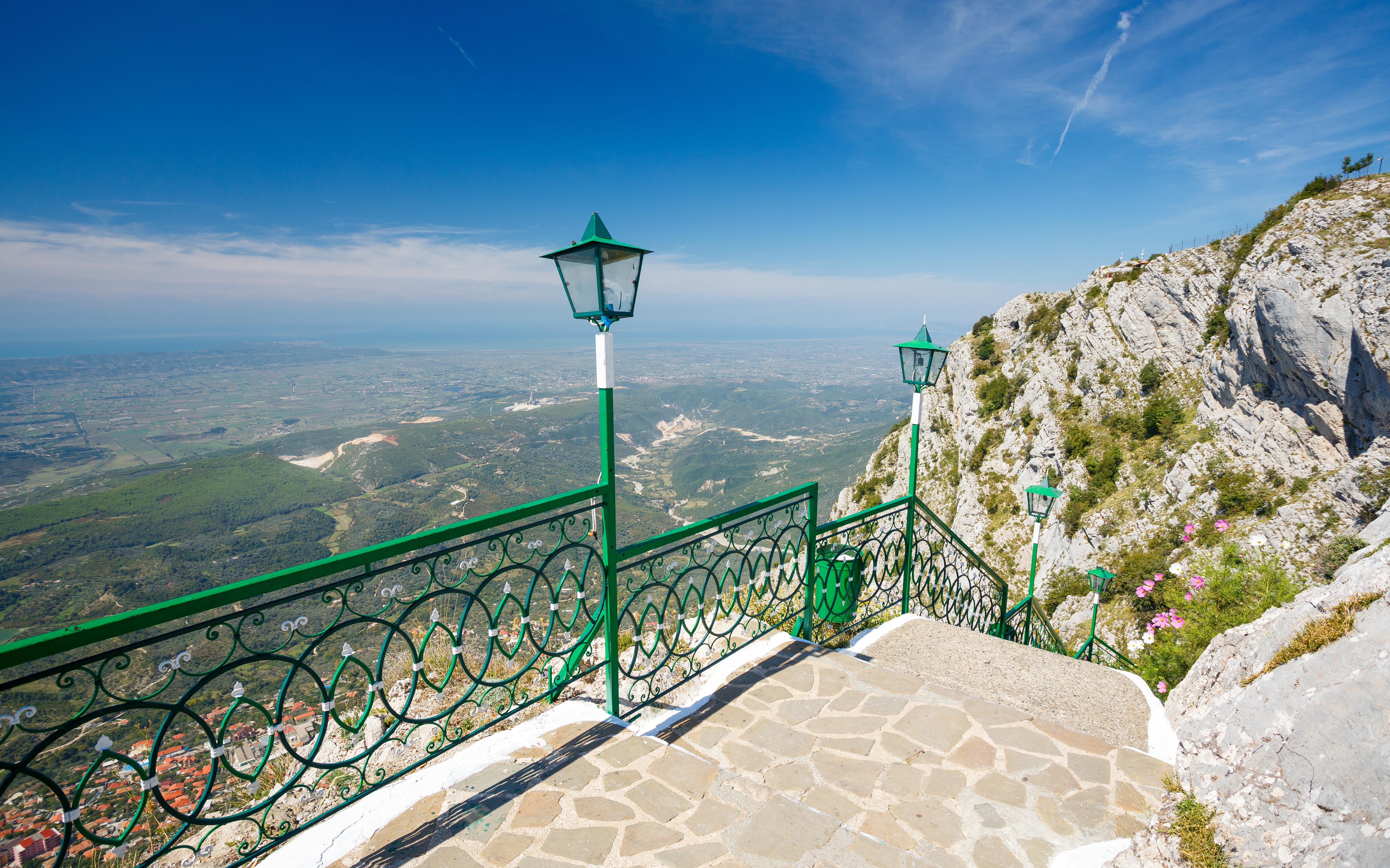 View from Sari Saltik, Kuja, Albania overlooking landscape and mountains.