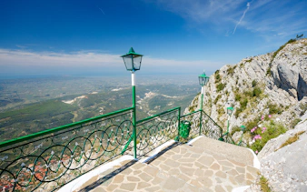 View from Sari Saltik, Kuja, Albania overlooking landscape and mountains.