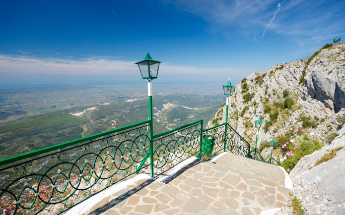 View from Sari Saltik, Kuja, Albania overlooking landscape and mountains.