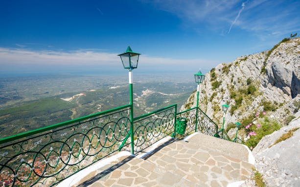 View from Sari Saltik, Kuja, Albania overlooking landscape and mountains.