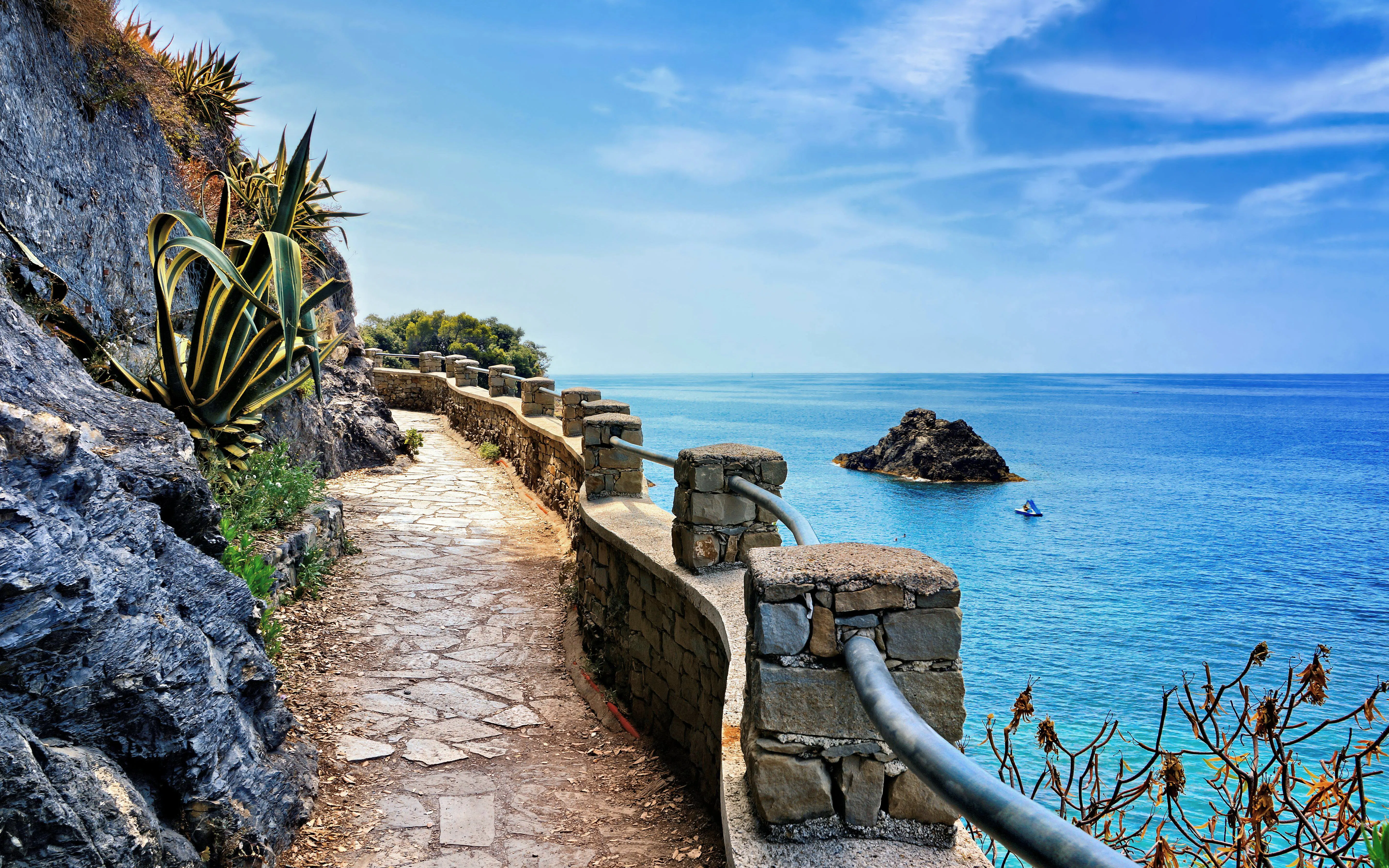 Stone path along the coast with sea view in Cinque Terre, Italy.