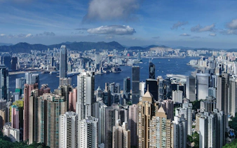 Hong Kong skyline view from Victoria Peak with skyscrapers and harbor.