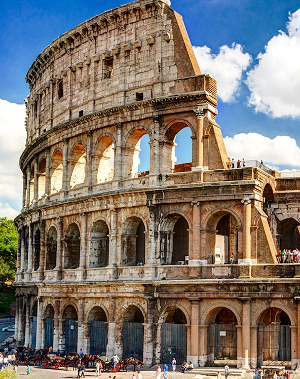 Colosseum in Rome with tourists exploring the ancient amphitheater.