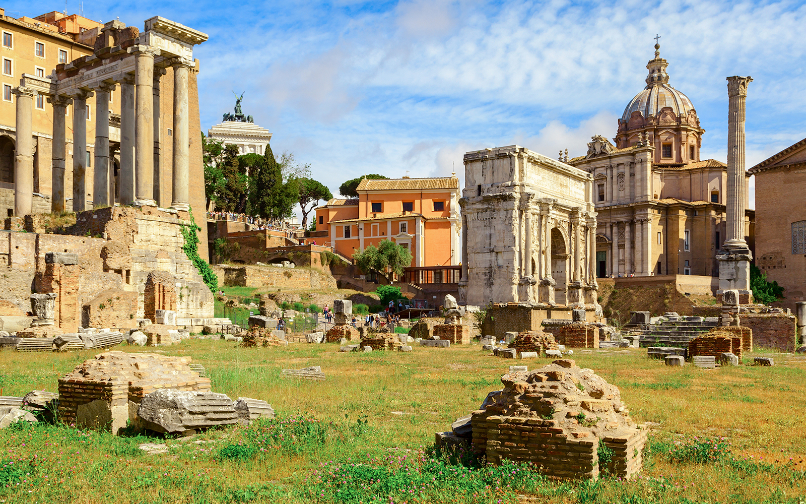 Palatine Hill ruins and Roman Forum with ancient columns and arches in Rome, Italy.
