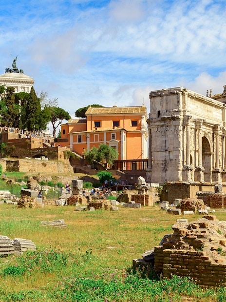 Palatine Hill ruins and Roman Forum with ancient columns and arches in Rome, Italy.